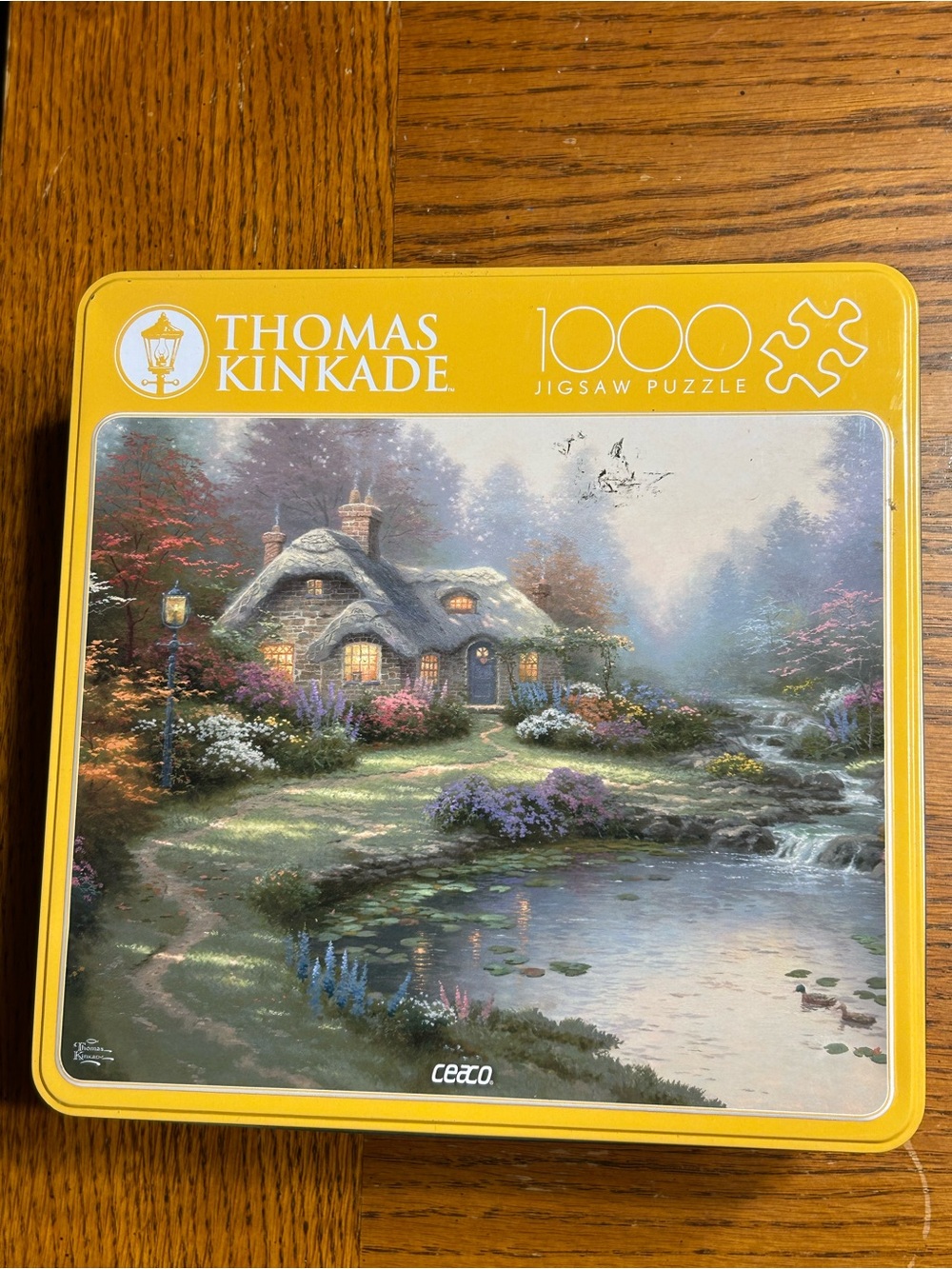Thomas Kinkade 1000-Piece Jigsaw Puzzle - Cottage scene with collectible tin box